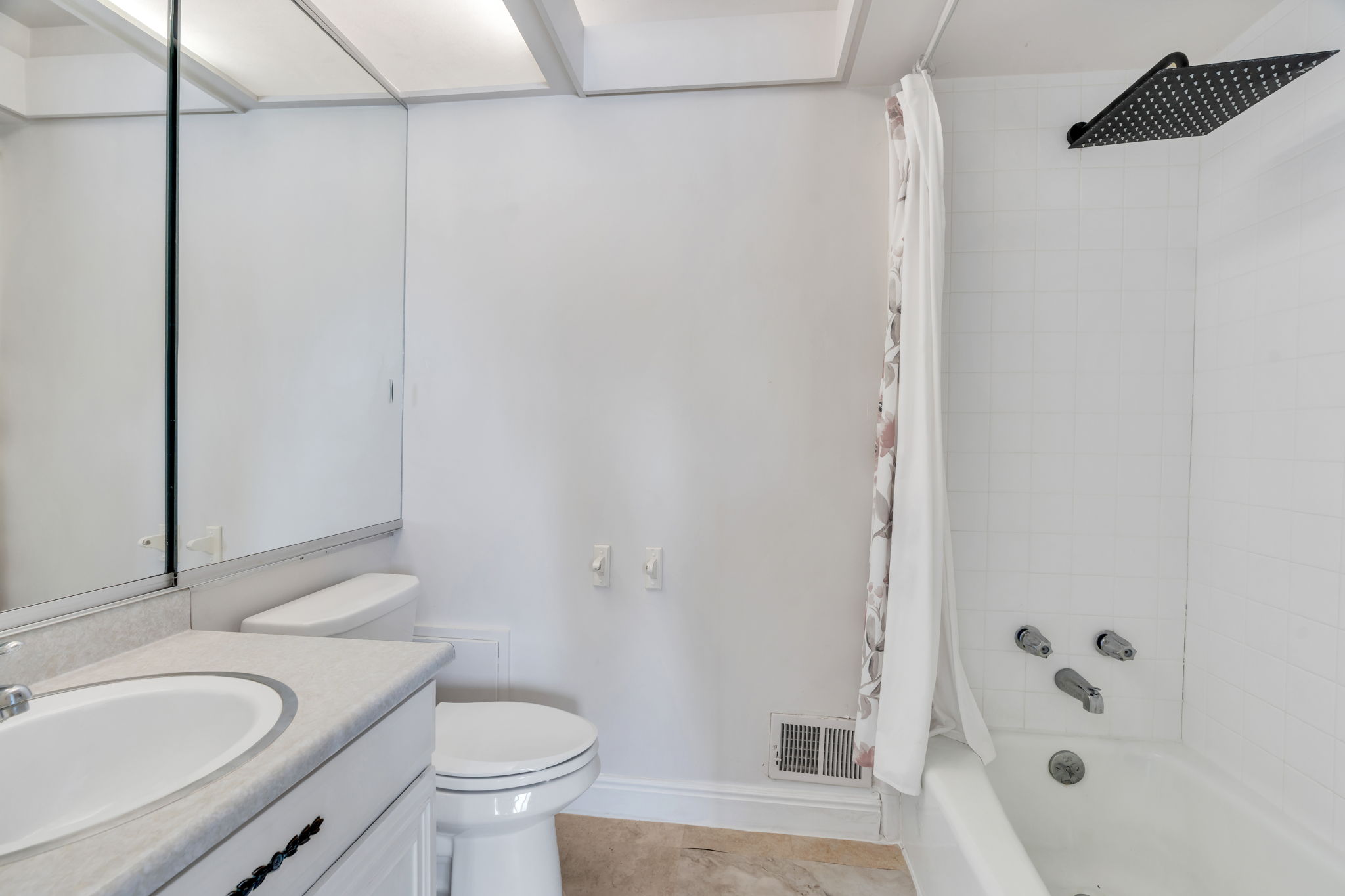 Bathroom featuring shower / tub combo with curtain and vanity