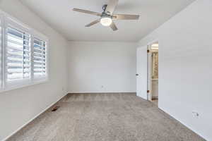 Bedroom with light colored carpet and ceiling fan