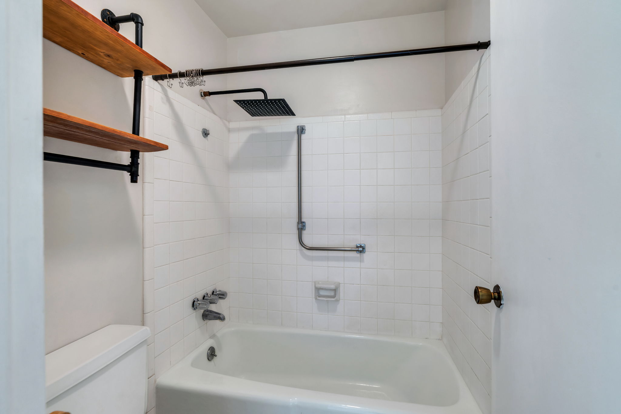 Full bath featuring shower / washtub combination and toilet
