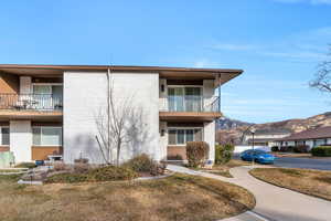 View of townhouse with a mountain view