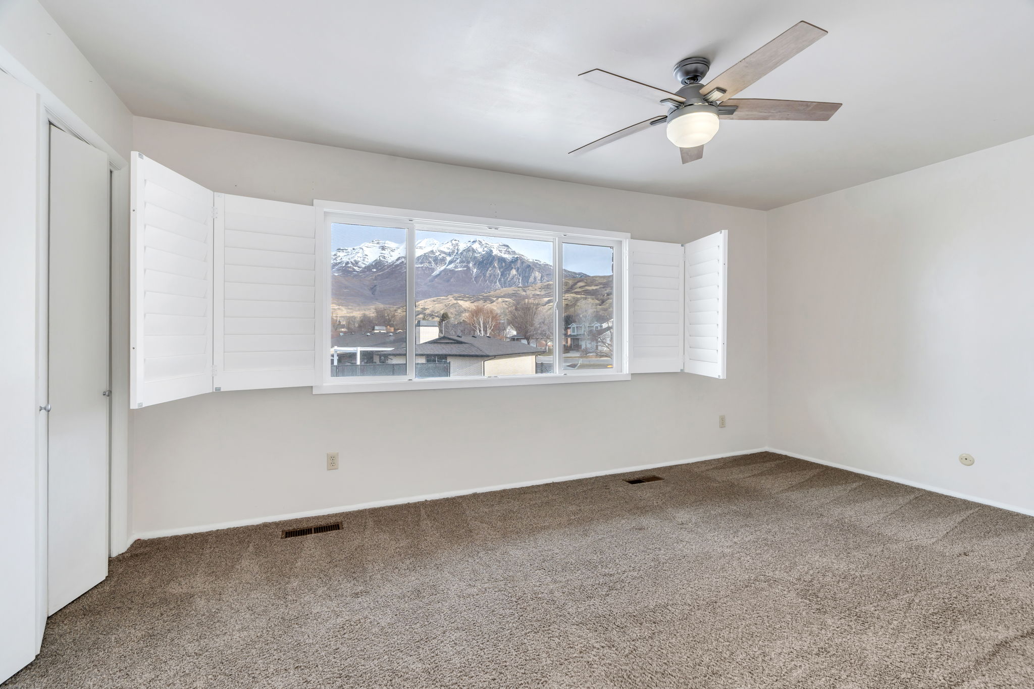 Bedroom with carpet flooring and a ceiling fan