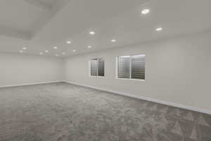 Unfurnished room featuring recessed lighting and light carpet