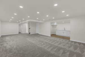 Finished below grade area with recessed lighting and carpet