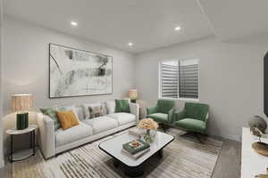 Living area featuring carpet and recessed lighting