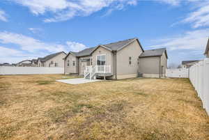 Rear view of property featuring a patio, a fenced backyard, stucco siding, a gate, and a wooden deck