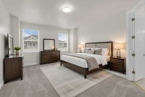 Bedroom with light colored carpet