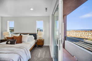 Carpeted bedroom featuring baseboards