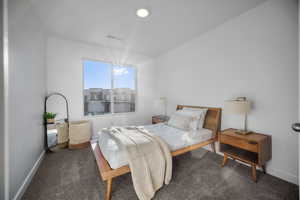 Carpeted bedroom with baseboards