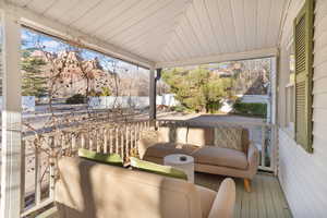 Wooden deck featuring an outdoor living space