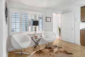 Living area with light wood-style floors
