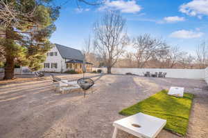 Fenced backyard with a patio