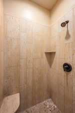Bathroom featuring tiled shower