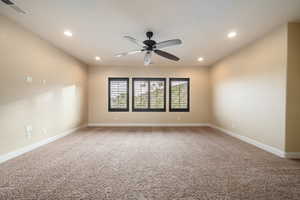 Empty room with light colored carpet, recessed lighting, and a ceiling fan
