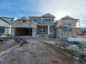 Property under construction featuring stone siding