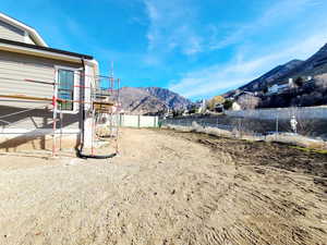 Fenced yard with a mountain view