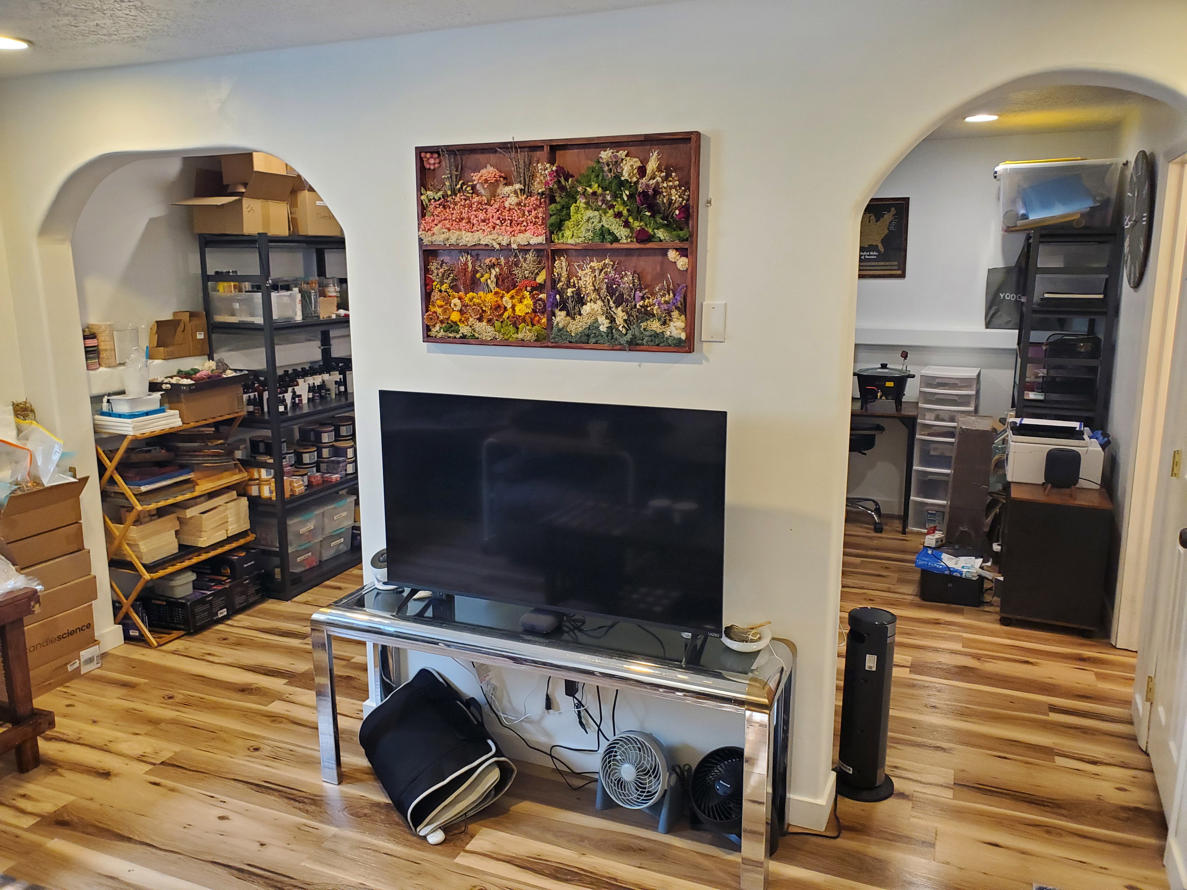 Living area featuring arched walkways, recessed lighting, and light wood finished floors