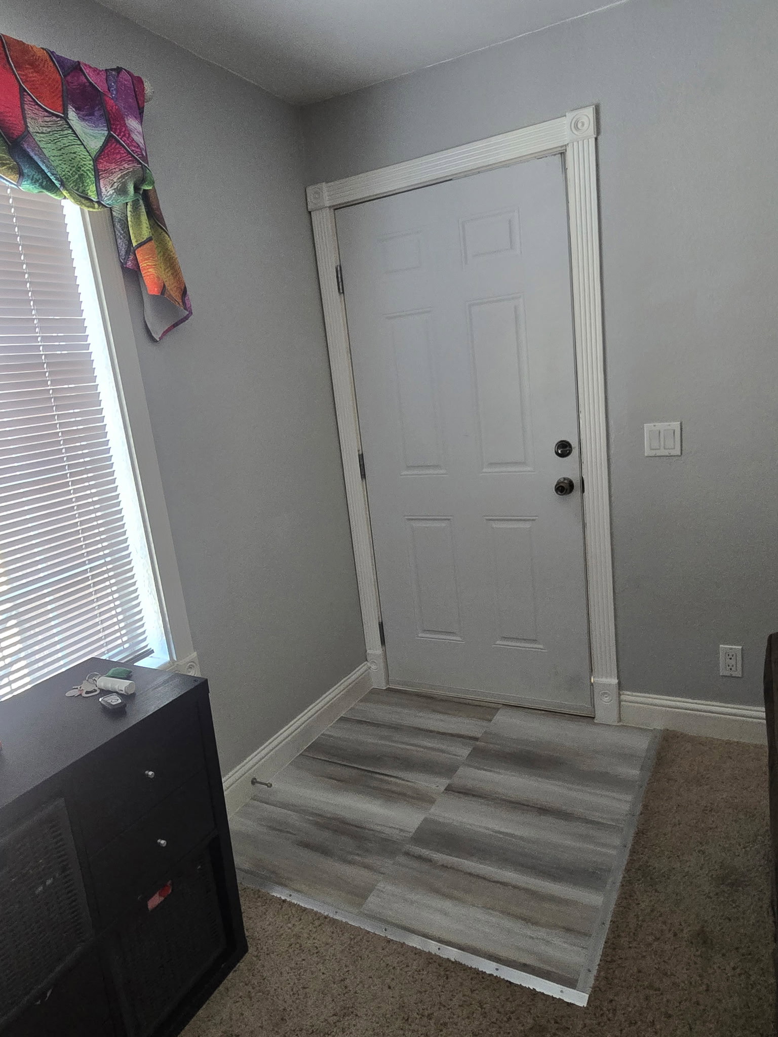 Updated waterproof luxury vinyl tile in entry way