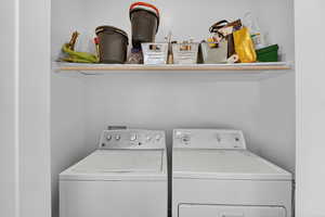 Laundry area featuring independent washer and dryer