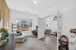 Home office with wood finished floors and baseboards