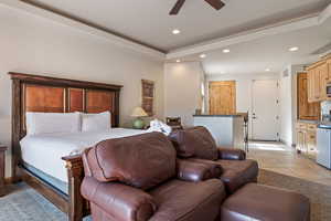 Bedroom featuring ceiling fan, recessed lighting, light tile patterned floors, and a raised ceiling