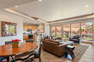Living room with a raised ceiling and recessed lighting
