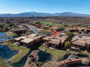 Aerial perspective of suburban area featuring a water and mountain view and a golf club