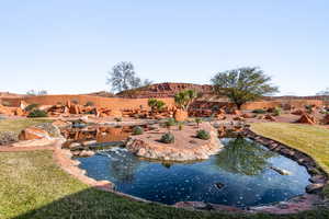 View of swimming pool featuring a garden pond