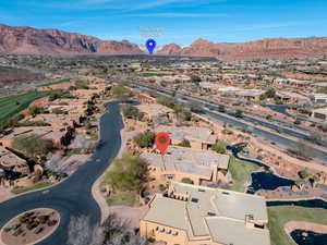 View of property location with nearby suburban area and a water and mountain view