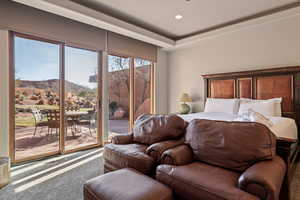 Carpeted bedroom with a mountain view, access to outside, and recessed lighting