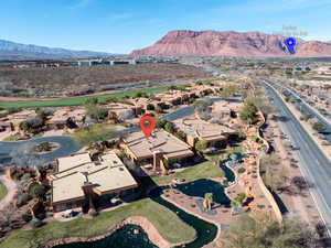 View of property location featuring mountains and nearby suburban area