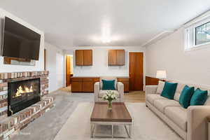 Cozy basement family room with fireplace.