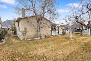 Viewed porch. of the backyard with a cover