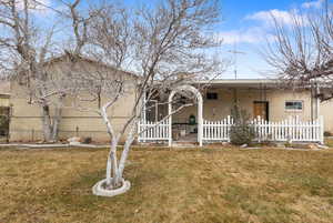 Viewed porch. of the backyard with a cover