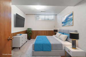 Basement bedroom with wooden walls and wainscoting
