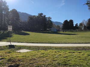 View of community featuring a gazebo, a mountain view, and a yard