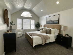 Bedroom with a textured ceiling, carpet flooring, lofted ceiling, and recessed lighting