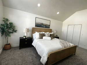 Bedroom featuring recessed lighting, vaulted ceiling, carpet, and a closet