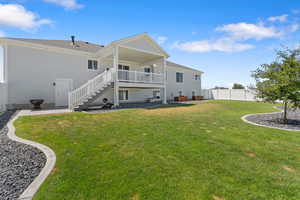 Rear view of property with stairs, a patio area, and a deck