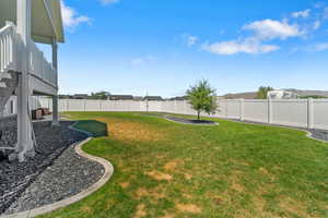 Fenced backyard with a patio