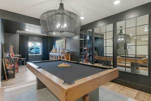 Game room featuring wood finished floors, billiards, and recessed lighting