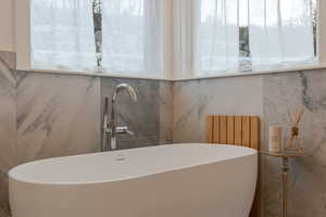 Bathroom view of a soaking tub and a sink