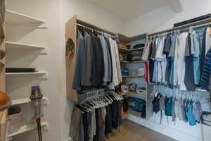 Spacious closet with light wood-style flooring
