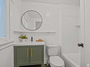 Bathroom with vanity and bathtub / shower combination