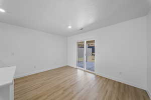 Unfurnished room featuring baseboards and light wood-style flooring