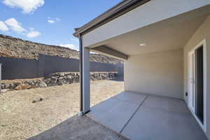 Fenced backyard with a patio and a mountain view