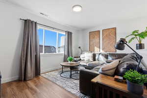 Living room with wood finished floors and baseboards