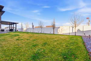Fenced backyard featuring a patio area