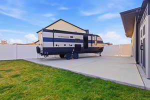 View of parking / parking lot featuring a fenced backyard