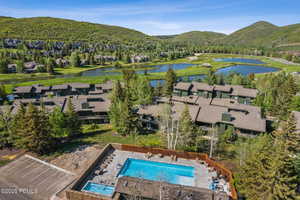 Bird's eye view of a pool and a water and mountain view