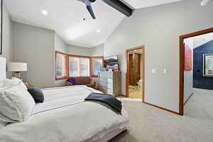 Bedroom with light carpet, beamed ceiling, recessed lighting, ceiling fan, and high vaulted ceiling